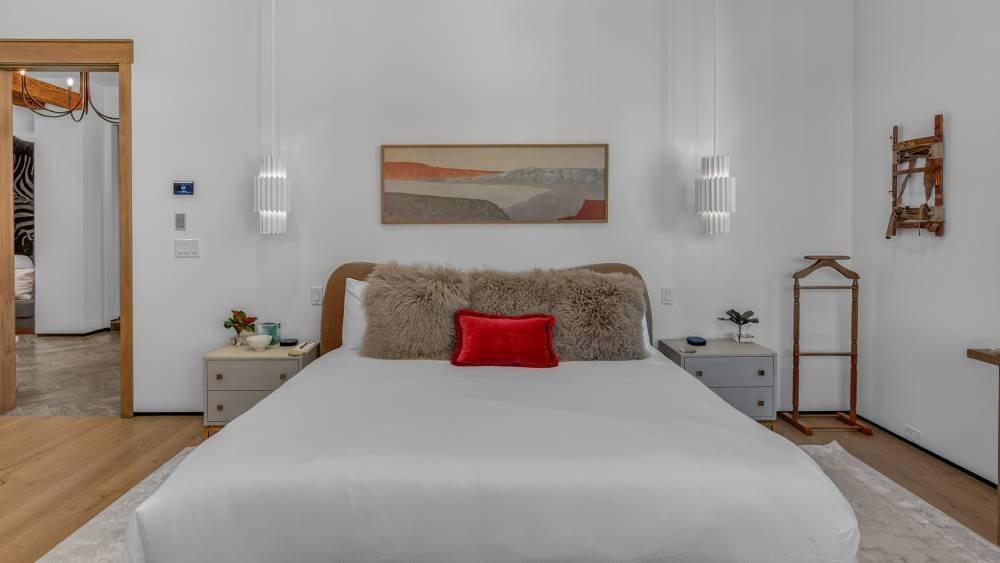 Primary king bedroom with bedside charging stations on the nightstands at Hawk’s View Chalet