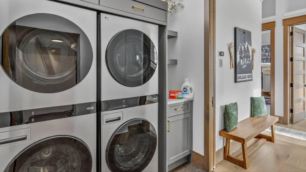 Two stacked washer and dryer sets at The Savory Lodge
