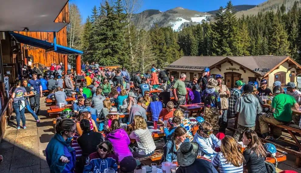 Après-ski gathering on an outdoor patio beside the slopes in Steamboat
