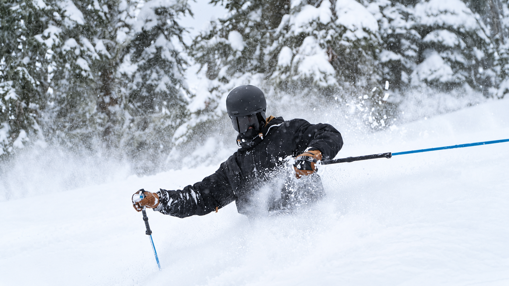 The Legendary Back Bowls sign framing snowy mountain terrain at Vail